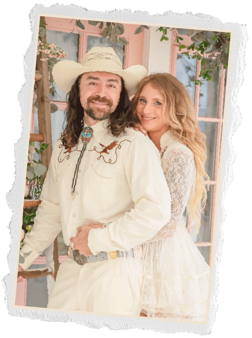 Torn edge photo of a couple in western wear, man in a cowboy hat